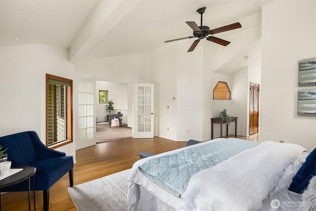 bedroom with french doors, high vaulted ceiling, wood finished floors, and a ceiling fan