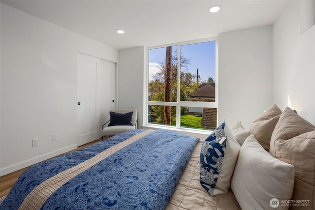 bedroom featuring recessed lighting, wood finished floors, and baseboards
