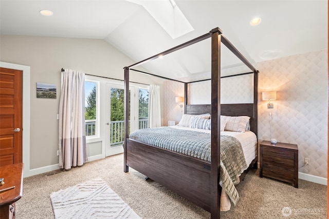 471 Dungeness Dr, Fox Island, WA 98333 - bedroom featuring access to exterior, a skylight, carpet flooring, vaulted ceiling, and baseboards