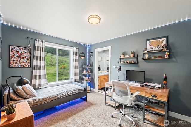 471 Dungeness Dr, Fox Island, WA 98333 - bedroom featuring light colored carpet, baseboards, a desk, and connected bathroom