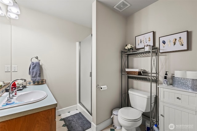 471 Dungeness Dr, Fox Island, WA 98333 - full bath featuring toilet, a shower stall, vanity, and baseboards