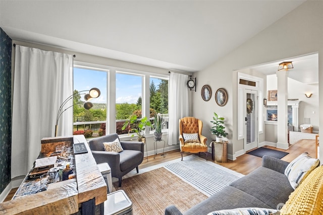 471 Dungeness Dr, Fox Island, WA 98333 - living area with vaulted ceiling, wood finished floors, and baseboards