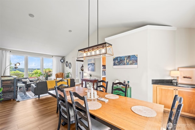 471 Dungeness Dr, Fox Island, WA 98333 - dining area featuring wood finished floors and high vaulted ceiling