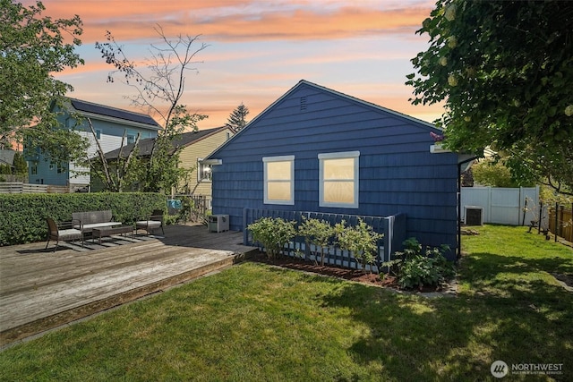 10229 35th Ave SW, Seattle, WA 98146 - back of property at dusk featuring a deck and cooling unit