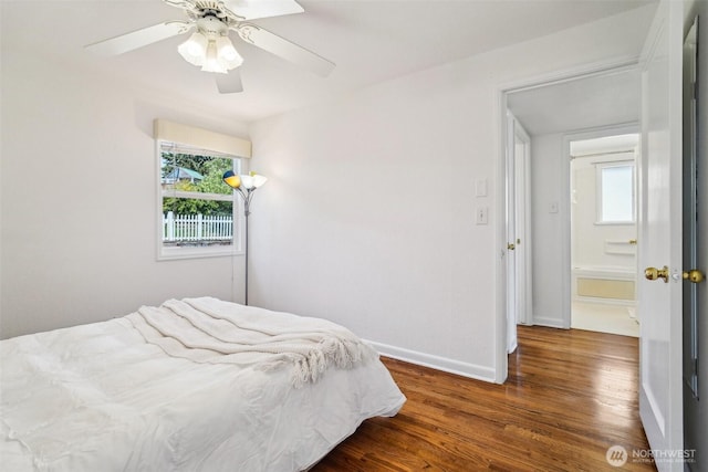 10229 35th Ave SW, Seattle, WA 98146 - bedroom with multiple windows, baseboards, wood finished floors, and ceiling fan