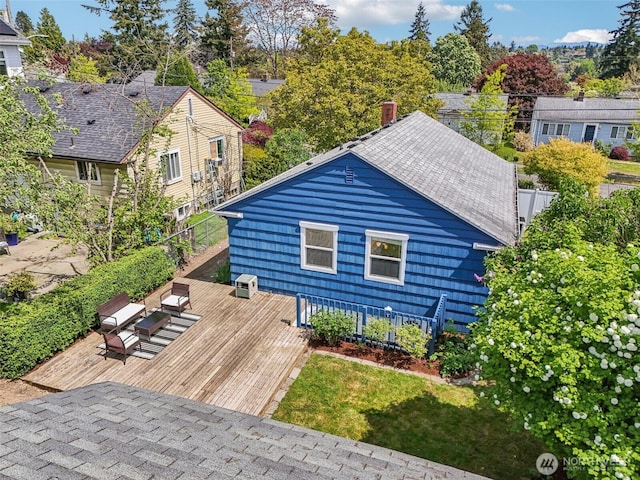 10229 35th Ave SW, Seattle, WA 98146 - exterior space featuring a wooden deck, a chimney, fence, and central AC