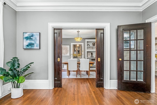 615 Boren Ave Unit 11, Seattle, WA 98104 - dining area with crown molding, wood finished floors, and baseboards