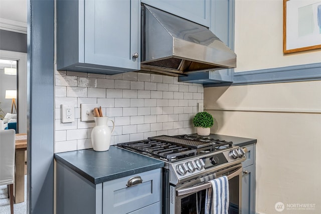 615 Boren Ave Unit 11, Seattle, WA 98104 - kitchen with stainless steel gas range, under cabinet range hood, backsplash, dark countertops, and ornamental molding