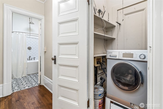 615 Boren Ave Unit 11, Seattle, WA 98104 - laundry area featuring washer / dryer, dark wood-style flooring, and baseboards