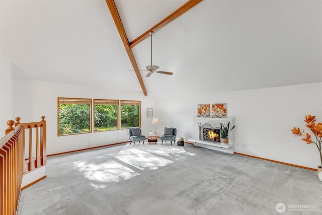 14930 15th Avenue Ct E, Tacoma, WA 98445 - unfurnished living room with carpet flooring, beamed ceiling, ceiling fan, baseboards, and a warm lit fireplace