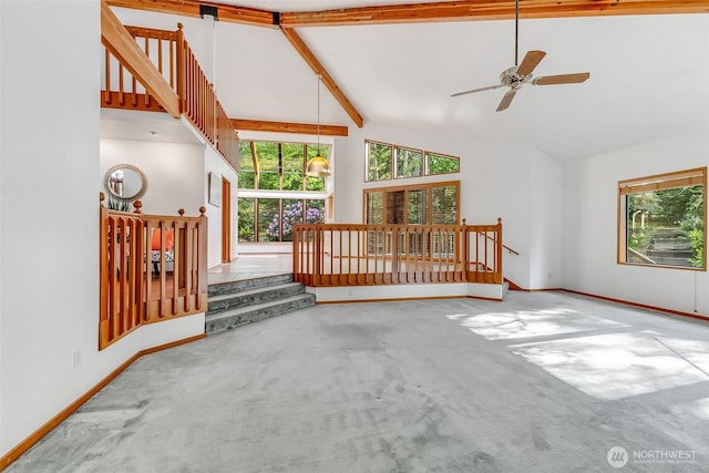 14930 15th Avenue Ct E, Tacoma, WA 98445 - unfurnished living room featuring high vaulted ceiling, plenty of natural light, carpet flooring, ceiling fan, and baseboards