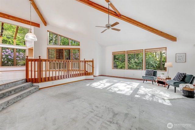 14930 15th Avenue Ct E, Tacoma, WA 98445 - unfurnished living room with carpet floors, beamed ceiling, a ceiling fan, high vaulted ceiling, and baseboards
