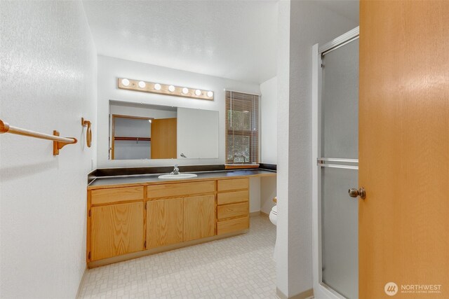 14930 15th Avenue Ct E, Tacoma, WA 98445 - bathroom with a stall shower, vanity, and toilet