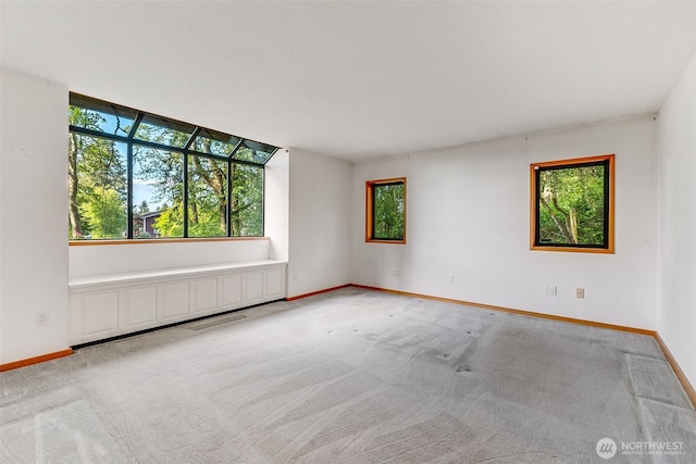 14930 15th Avenue Ct E, Tacoma, WA 98445 - empty room featuring healthy amount of natural light, carpet, and baseboards