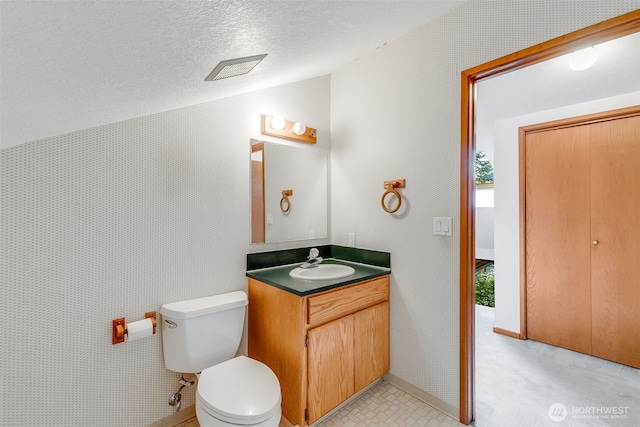 14930 15th Avenue Ct E, Tacoma, WA 98445 - half bath featuring vaulted ceiling, vanity, toilet, and a textured ceiling