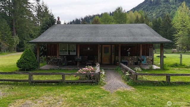 588 Mineral Creek Rd, Mineral, WA 98355 - view of front of house featuring a wooded view, a chimney, a mountain view, and stone siding