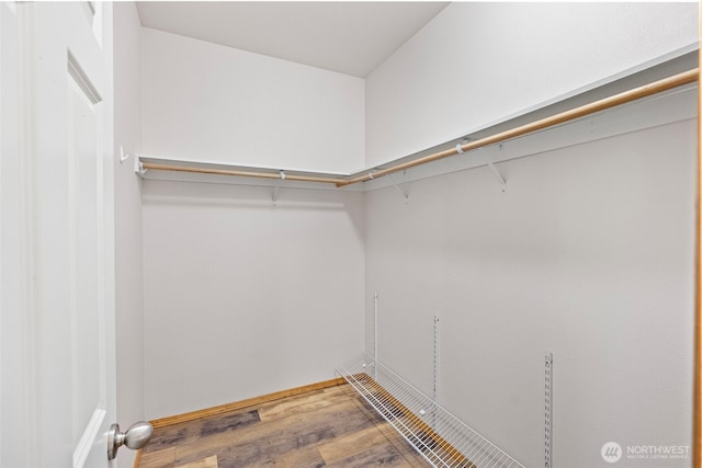 19554 Jensen Way NE, Poulsbo, WA 98370 - walk in closet with wood finished floors