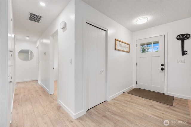 19045 Nutmeg St SW, Rochester, WA 98579 - foyer featuring light wood-type flooring and baseboards