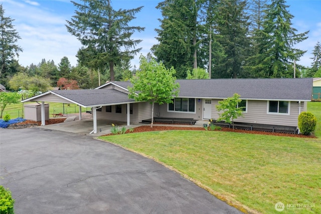 19045 Nutmeg St SW, Rochester, WA 98579 - ranch-style house featuring a front yard, asphalt driveway, an attached carport, and roof with shingles