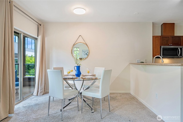 1000 Aurora Ave N Unit 311, Seattle, WA 98109 - dining room with light carpet and baseboards