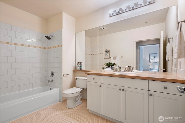 1000 Aurora Ave N Unit 311, Seattle, WA 98109 - bathroom featuring toilet, vanity, shower / bath combination, and tile patterned flooring