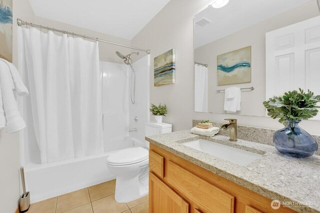 full bathroom featuring tile patterned flooring, toilet, vanity, and shower / bathtub combination with curtain