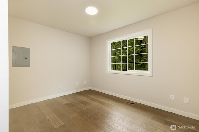 12605 Monte Cristo Way, Granite Falls, WA 98252 - spare room with electric panel, dark wood-style flooring, and baseboards