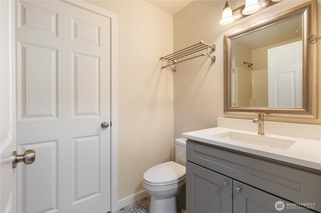 12605 Monte Cristo Way, Granite Falls, WA 98252 - bathroom featuring vanity, toilet, and baseboards