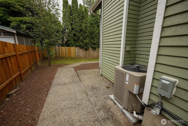 11857SE 321st Pl, Auburn, WA 98092 - view of patio featuring a fenced backyard and cooling unit