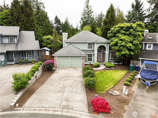 11857SE 321st Pl, Auburn, WA 98092 - traditional-style home featuring a garage, driveway, a chimney, brick siding, and fence