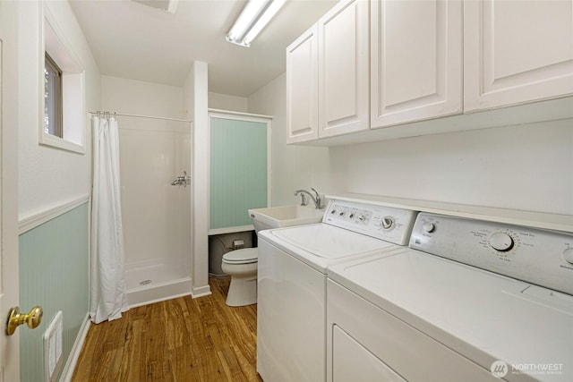 255 Alder St, Orcas Island, WA 98245 - laundry area featuring wood finished floors and washer and clothes dryer