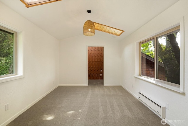 255 Alder St, Orcas Island, WA 98245 - carpeted spare room with a baseboard heating unit, a skylight, lofted ceiling, and baseboards