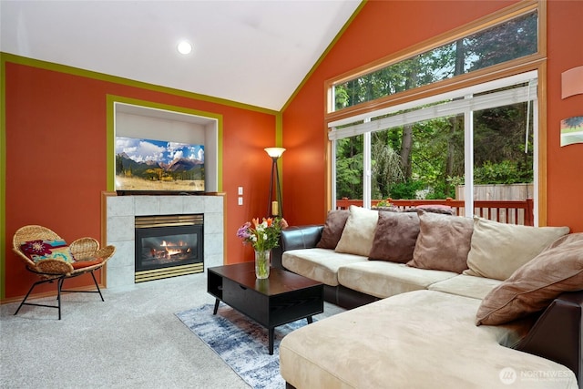 202 170th Pl SE, Bothell, WA 98012 - living area featuring carpet flooring, a tiled fireplace, and high vaulted ceiling