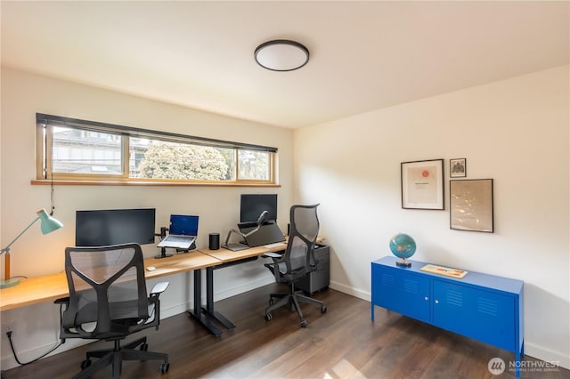office space featuring wood finished floors and baseboards
