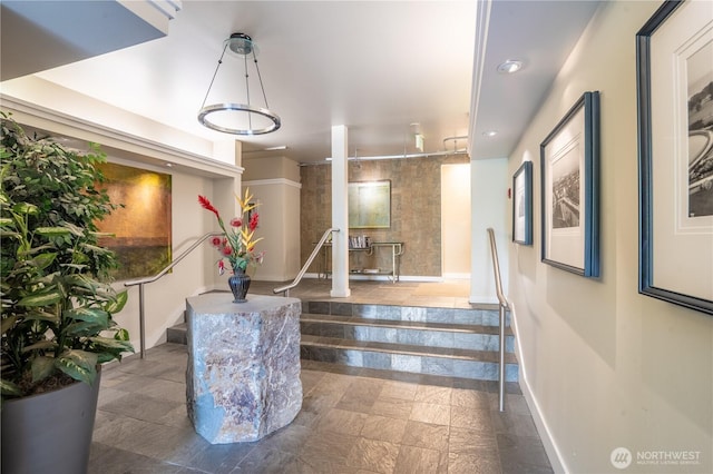 building lobby featuring stairs and recessed lighting