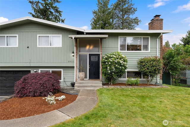 20113 4th Pl S, Des Moines, WA 98198 - bi-level home with a chimney and an attached garage