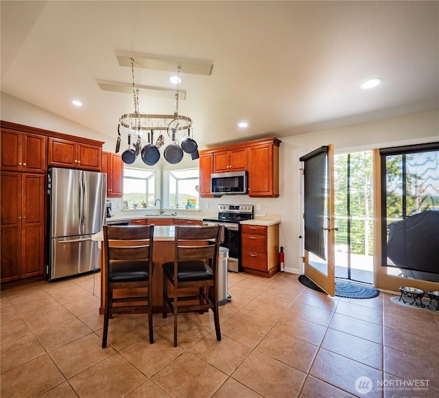 2207 Island Dr NW, Olympia, WA 98502 - kitchen featuring appliances with stainless steel finishes, plenty of natural light, a sink, light countertops, and recessed lighting