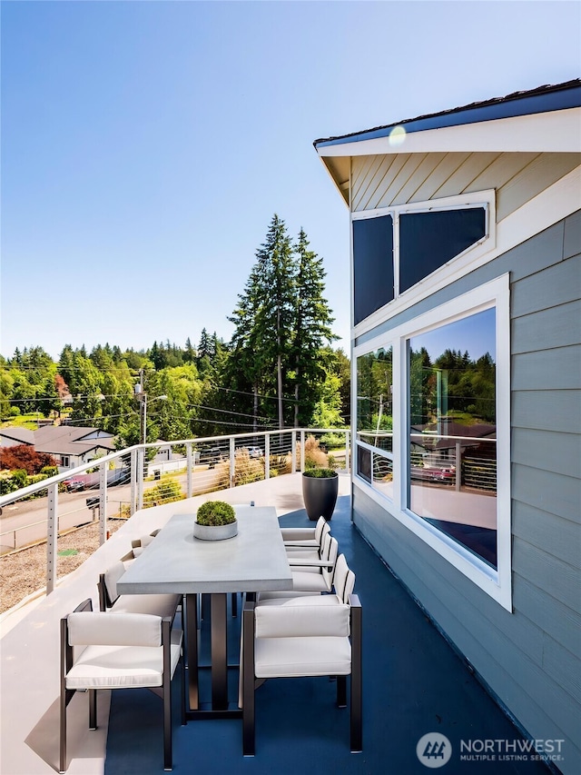 2207 Island Dr NW, Olympia, WA 98502 - view of patio / terrace with a balcony and outdoor dining space