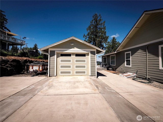 2207 Island Dr NW, Olympia, WA 98502 - detached garage featuring concrete driveway