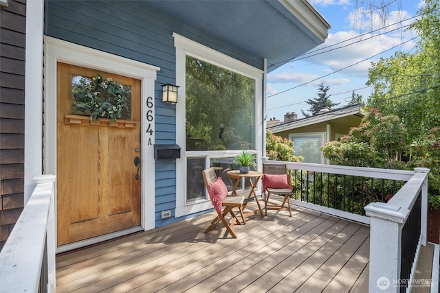664 W Emerson St Unit A, Seattle, WA 98119 - wooden terrace with a porch