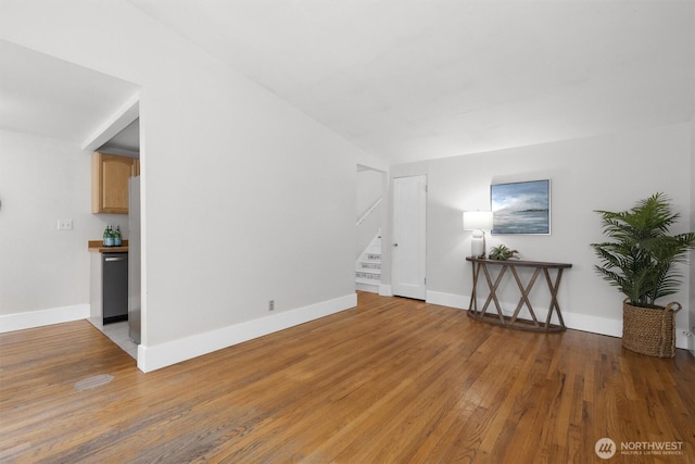 664 W Emerson St Unit A, Seattle, WA 98119 - unfurnished living room with stairway, wood finished floors, and baseboards