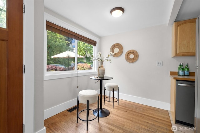 664 W Emerson St Unit A, Seattle, WA 98119 - dining space with light wood-type flooring and baseboards
