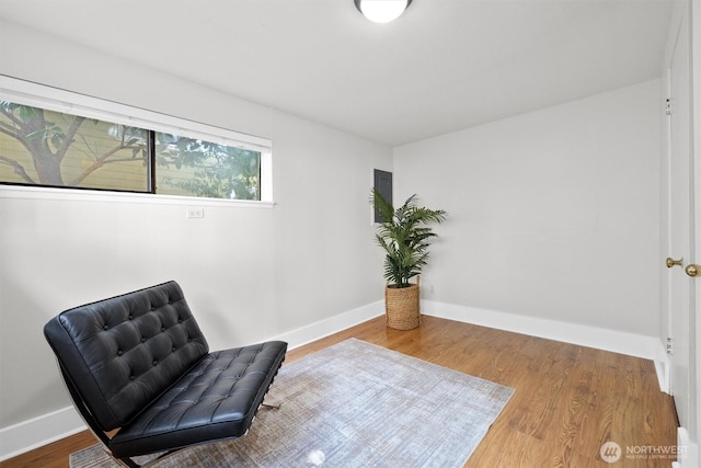 664 W Emerson St Unit A, Seattle, WA 98119 - sitting room featuring wood finished floors and baseboards