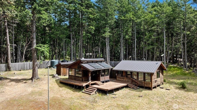 35 N Airport Way, Stuart Island, WA 98250 - back of property featuring metal roof and a wooden deck
