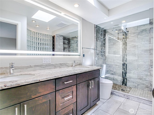 4441 53rd Ave SW, Seattle, WA 98116 - bathroom featuring a stall shower, double vanity, a skylight, recessed lighting, and tile patterned flooring