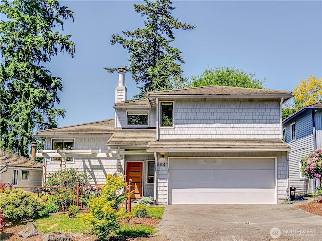 4441 53rd Ave SW, Seattle, WA 98116 - view of front facade with a garage, a chimney, and driveway