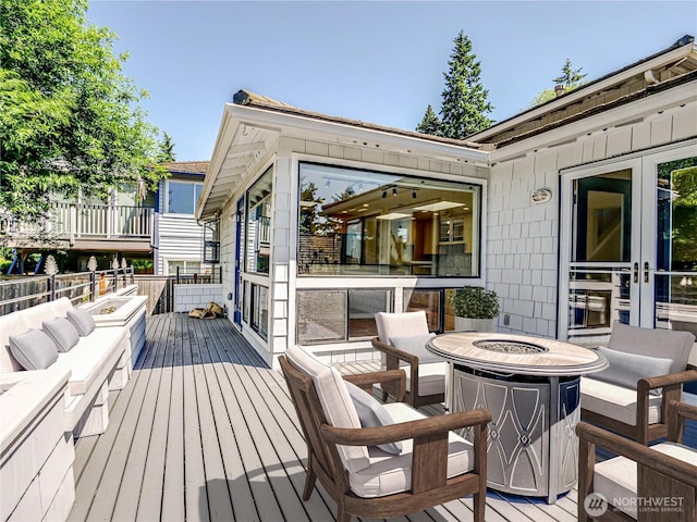 4441 53rd Ave SW, Seattle, WA 98116 - wooden deck featuring a fire pit
