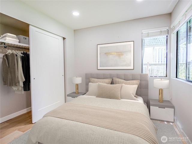 4441 53rd Ave SW, Seattle, WA 98116 - bedroom with multiple windows, recessed lighting, light wood-style floors, and a closet