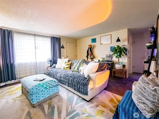 carpeted living room featuring a textured ceiling