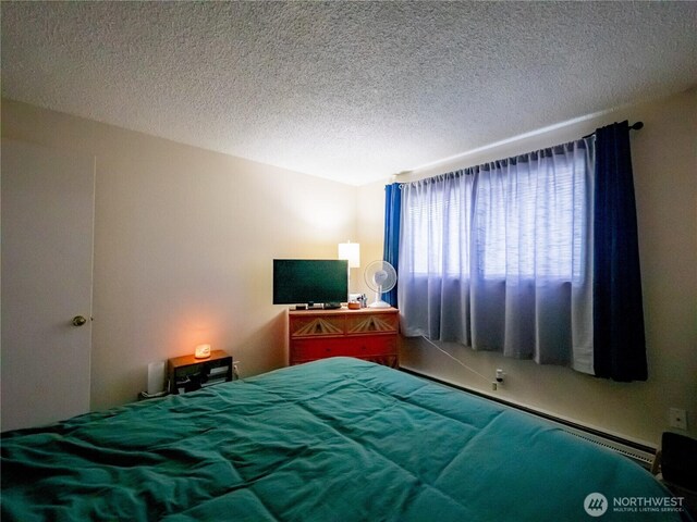 bedroom featuring a textured ceiling